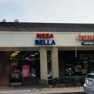 a car parked in front of a restaurant
