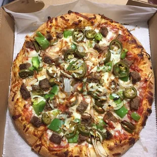 Beef, onions, green peppers and jalapeños. Tasty Pizza!