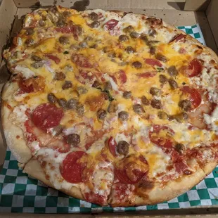 A sloppy pathetically over topped pizza