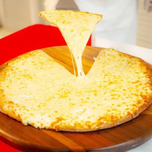 White Pie: Ricotta cheese spread topped with mozzarella. (No sauce)