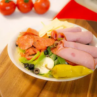 Antipasto Salad: Pepperoni, Ham, Provolone and Provolone on top our garden salad.