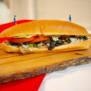 veggie Sub American Style: Cucumber, mushroom, onion, green pepper, spinach, lettuce, tomatoes, mayo, mustard