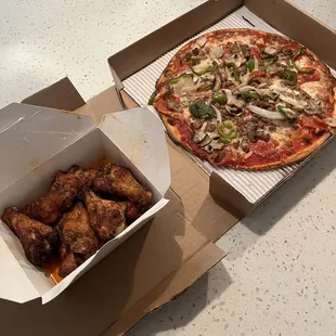 Umberto ultra thin crust pizza and buffalo wings.