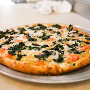 a freshly baked pizza on a pan