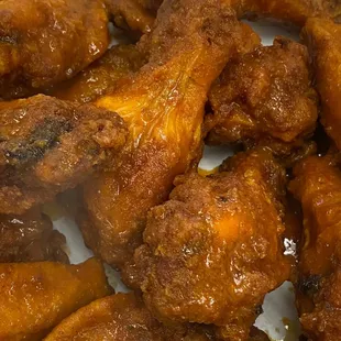 a plate of chicken wings and rice