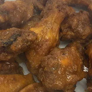 a plate of chicken wings and rice