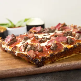 a slice of pizza on a cutting board