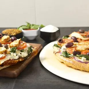 two slices of pizza on plates