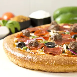 pepperoni, sausage, olives, and peppers