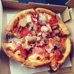 All meat pizza, very flavorful but topping and cutting could use some love too!