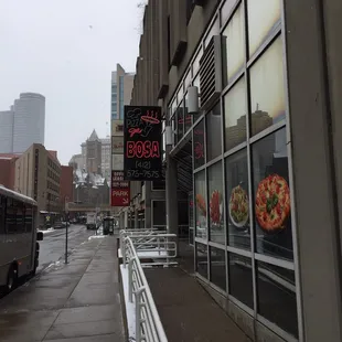 outside of a restaurant on a rainy day