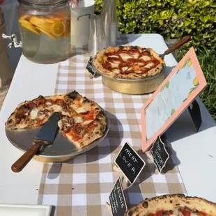 a table full of pizzas