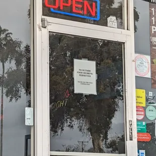 open sign in window of restaurant