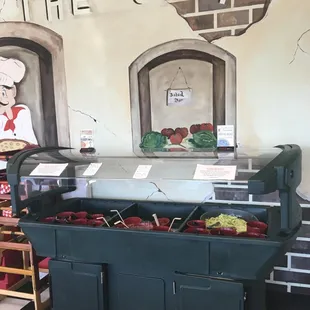 a counter with a variety of food items