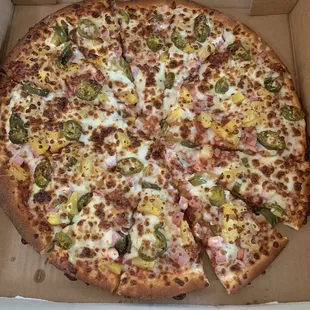 a pizza in a cardboard box