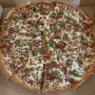 a pizza in a cardboard box