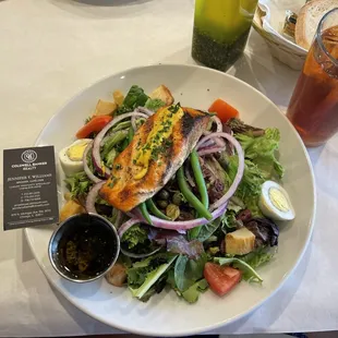 a plate of salad and a drink