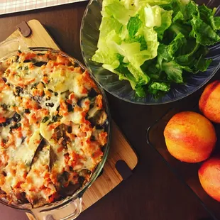 This is not one of the unusual nights at Pizza Care! Eggplant parmesan with garlic, potato, tomatoes and greens! Sides: rice and salad!