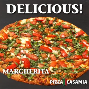 a delicious pizza with tomatoes and basil