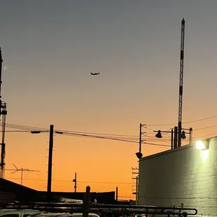 an airplane flying over a building