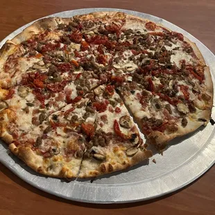 Pizza Castle.  Our 16&quot; pizza with four ingredients, bacon, sun dried tomatos, meatballs and mushrooms.