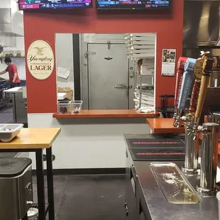 Inside sitting at the bar.