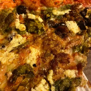a close up of a slice of pizza