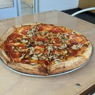 Pepperoni and mushroom pizza