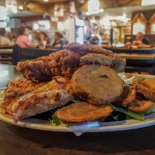 a pile of fried chicken on a plate