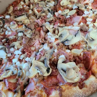 5 meat pizza with mushrooms and onions