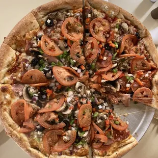 view of 16" Chef's Abbondanza Pizza (note: slice actively and immediately being claimed)