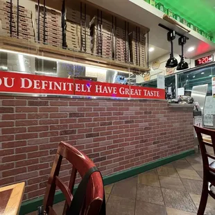 a brick wall with a sign that says you definitely have great taste