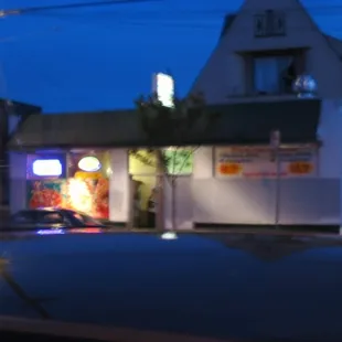 a car parked in front of a restaurant