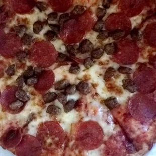 Medium sausage pepperoni pizza