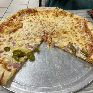 Their cheese pizza with half ham, pineapple and jalapeños.