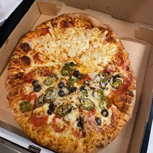 Half extra pineapple and pepperoni and half pepperoni, mushroom, jalapeño, and black olives! Perfectly done!