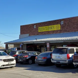 cars parked in front of the restaurant