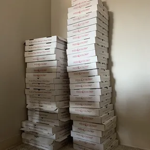 a stack of pizza boxes