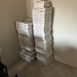 a stack of pizza boxes