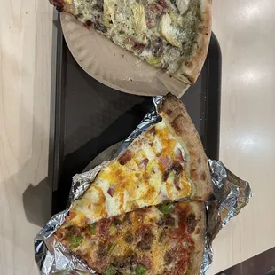two slices of pizza on a tray