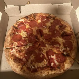 a pepperoni pizza in a box