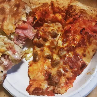 two slices of pizza on a paper plate