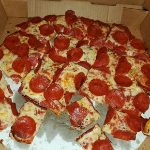 a pepperoni pizza in a box