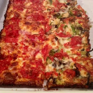 Half pepperoni (they forgot the olives) and half vegetarian. Ask for extra crisp!