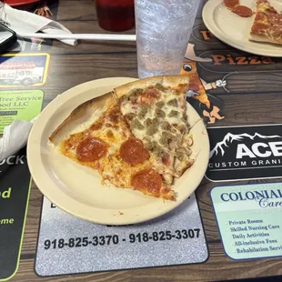 Pepperoni pizza and sausage pizza and sprite