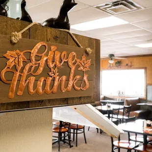 a wooden sign hanging from the ceiling