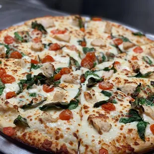 a whole pizza on a plate