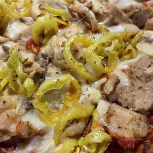 Cauliflower crust pizza with chicken mushrooms and banana peppers- so delicious
