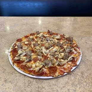 Medium, Pep, sausage, mushrooms hot to the table.