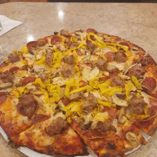 Medium pizza - pepperoni, sausage, mushrooms, banana peppers